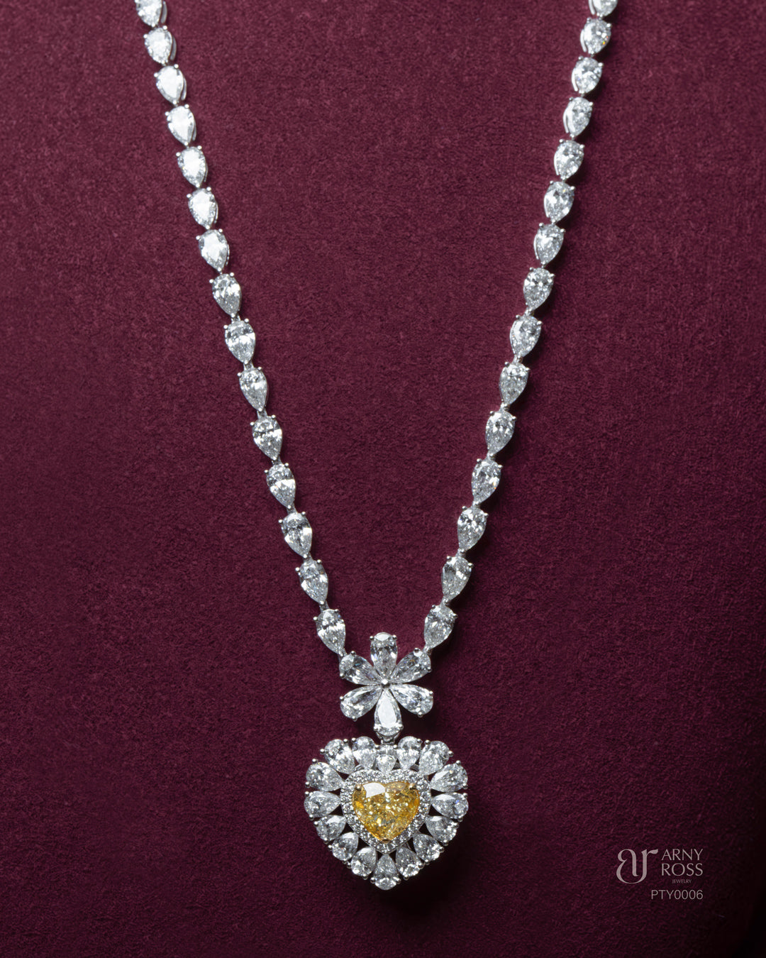 Pear Cut Diamond Necklace with Yellow Diamond Heart Pendant