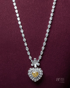 Pear Cut Diamond Necklace with Yellow Diamond Heart Pendant