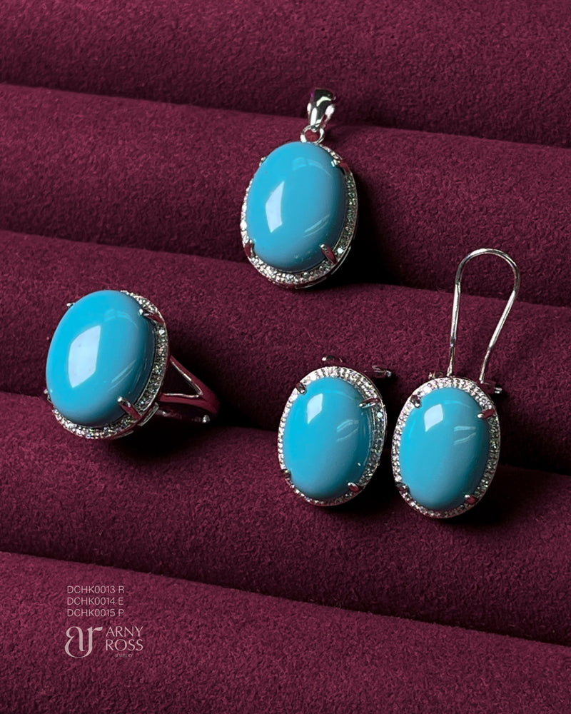 Oval Turquoise Cabochon with Diamond Halo