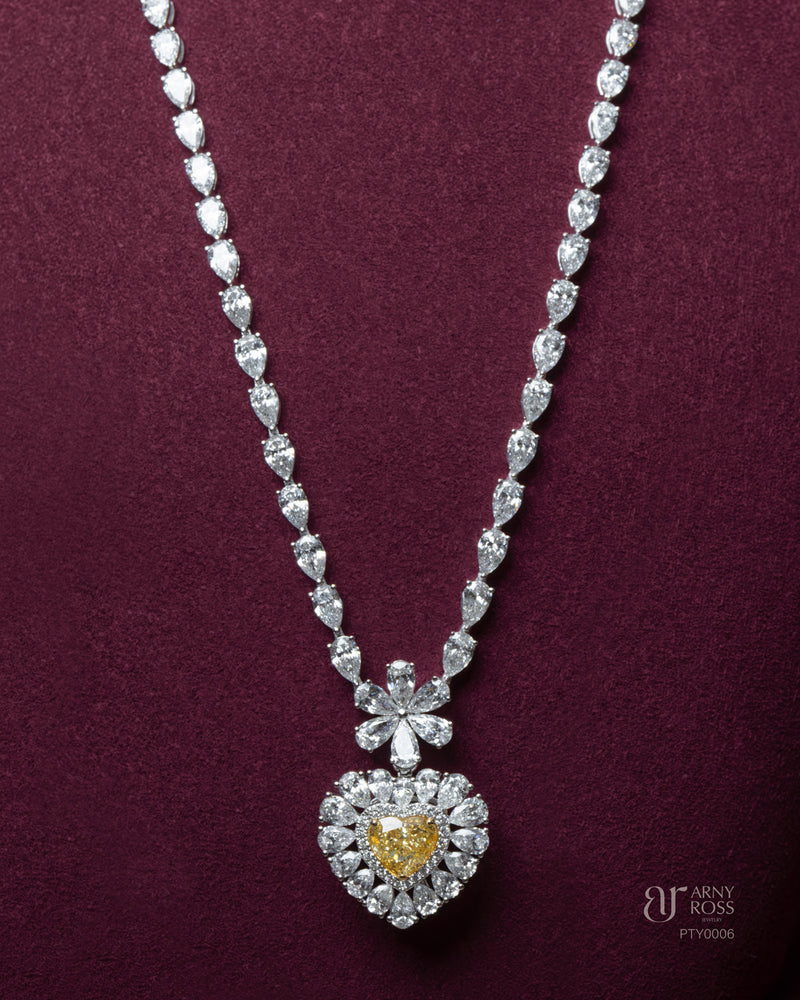 Pear Cut Diamond Necklace with Yellow Diamond Heart Pendant
